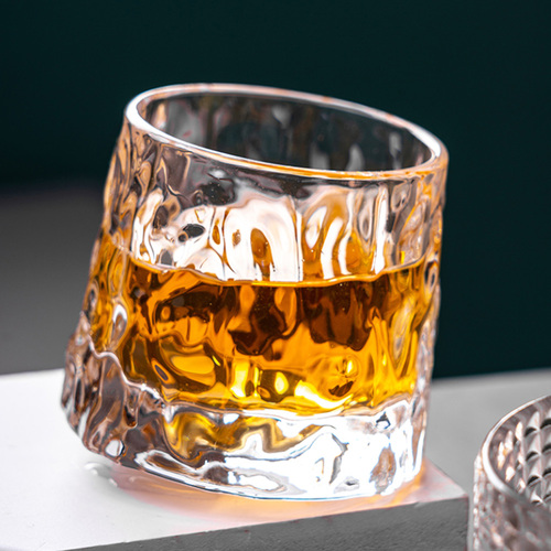 Rotating whiskey glass